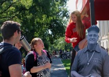Rachel Pry, a second-year in material science engineering at OSU, fixes a sign on top of her booth whileAndrew Drozd, a fourth-year in neuroscience at OSU, and another student look on during Founder's Day, Thursday, Sept. 17, 2015 at Ohio State University in Columbus, Ohio. Ohio Staters, Inc. and University Libraries held the event in commemoration of the first day of classes at Ohio State Sept. 17, 1873.